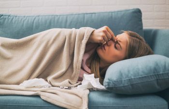 Woman having pain in sinus and fever.