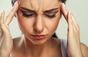 Young woman with headache.