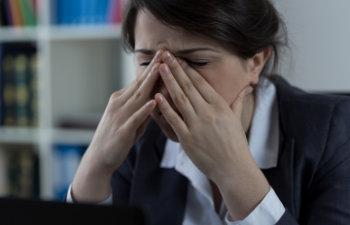 businesswoman with huge sinus pain